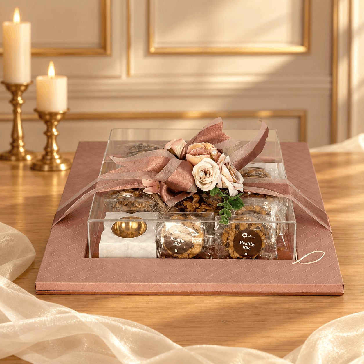 A brass diya set beside a Nazranaa gift